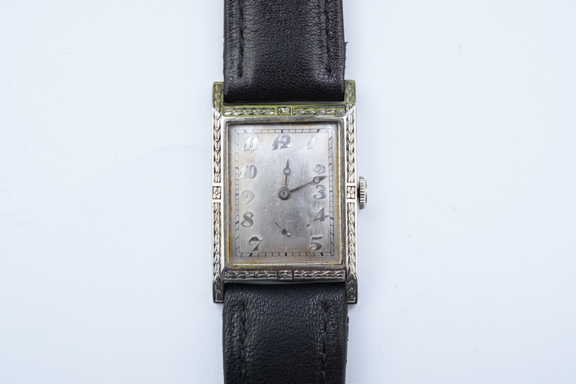 A lady's 18k white gold International Watch Company manual wind wrist watch, on a later associated leather strap
